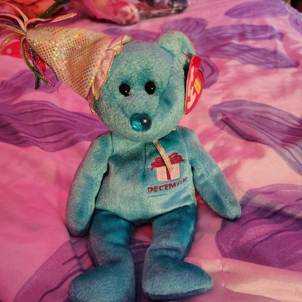 ty toy Groovy Jan.1999 color blue and gold and red. 12 inches 7 inches wide